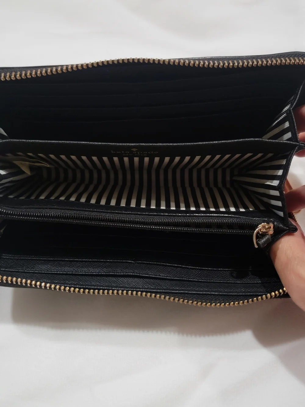 kate spade black zip-around Saffiano leather wallet with gold logo